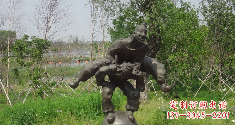 长沙园林站在球上面跳山羊的人物景观铜雕